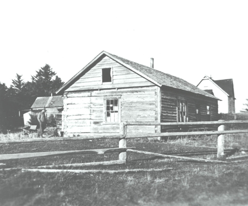 Afognak-Village-1943-guy-and-house.jpg